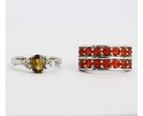 A Mexican fire opal set 925 silver ring together with an ambilobe sphene and white zircon set 925 silver ring, (K.5), (J.5). 