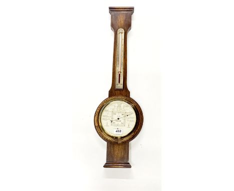 An S&amp;M Stormoguide oak barometer and thermometer, H. 75cm.
