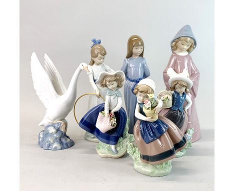 Three Lladro porcelain figurines of children with flowers, a Lladro swan and three Nao porcelain figures of children, tallest