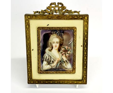 A gilt framed hand painted portrait miniature of a lady, frame size 12 x 16cm.
