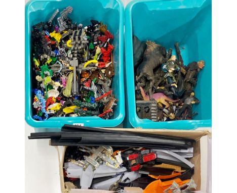 A quantity of transformer models with a quantity of Lord of the rings figures and other items.