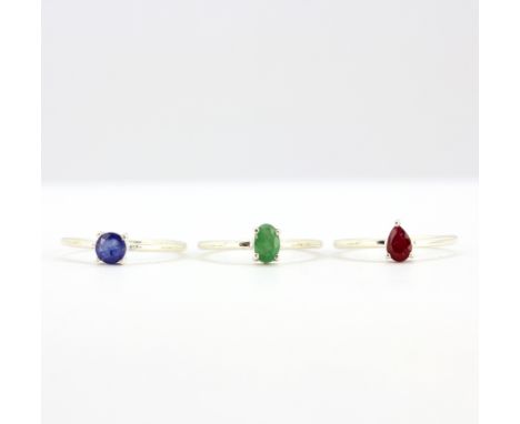 Three 925 silver stacking rings set with ruby, emerald and sapphire.