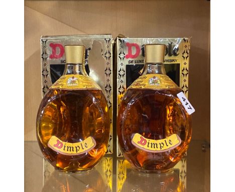 Two bottles of vintage Dimple scotch whiskey.