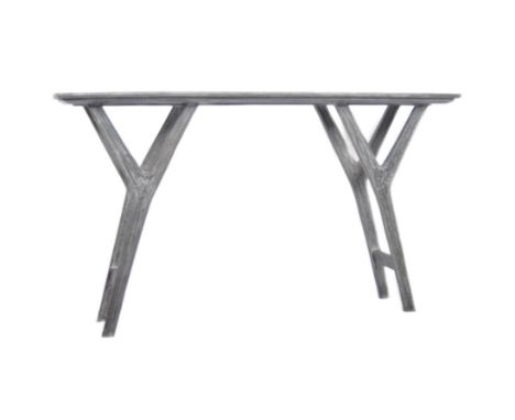 A contemporary designer distressed&nbsp;console hall table having an elongated rectangular top raised on shaped supports unit