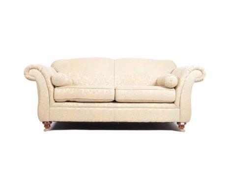 Kirkdale - A large Contemporary Designer two seat sofa settee upholstered in striped turquoise and gold toned floral fabric r