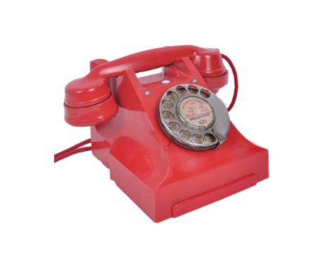 A mid 20th Century 1950s red vintage type 300 Bakelite desk phone / telephone with alphabetical ring dial, labelled Brighton 