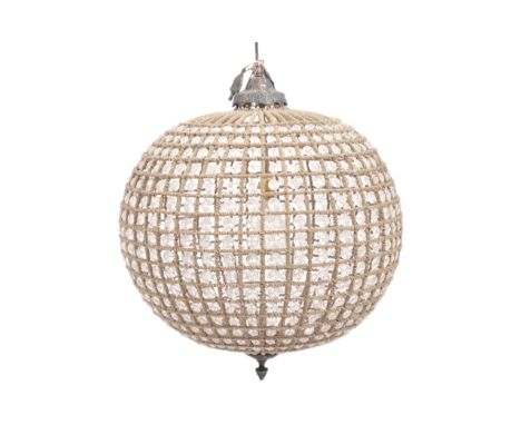 A large contemporary spherical hanging ceiling light chandelier having a woven metal frame interspersed with clear faceted be