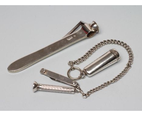 AN EDWARDIAN SILVER CIGAR CUTTER, maker's mark rubbed, London 1904, 6" long, together with a graduated curb link silver alber