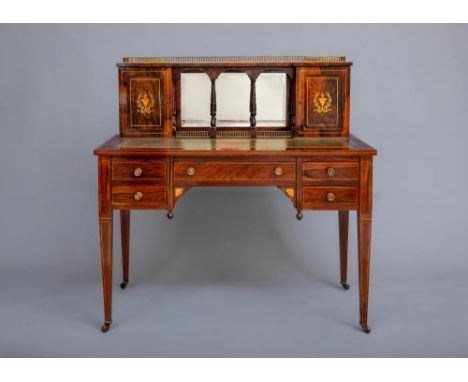 A LATE VICTORIAN SHERATON REVIVAL ROSEWOOD AND MARQUETRY WRITING TABLE, the raised back with pierced brass gallery, central m