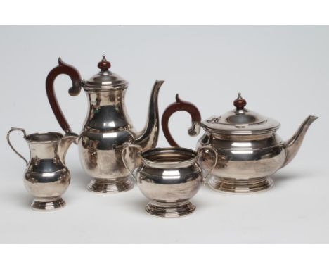 A SILVER FOUR PIECE TEA SERVICE maker Cooper Bros. &amp; Sons, Sheffield 1968, of baluster form comprising teapot and hot wat