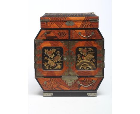 A JAPANESE SPECIMEN WOOD PARQUETRY TABLE CABINET, Meiji period, of canted oblong form with hinged cover opening to reveal com