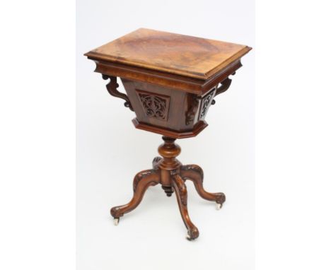 A VICTORIAN BURR WALNUT WORK TABLE of oblong form, the hinged lid opening to a fitted interior over a canted square tapering 