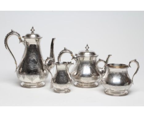 A VICTORIAN SILVER FOUR PIECE TEA AND COFFEE SERVICE, maker Edward Charles Brown, London 1874, of baluster form, wriggle and 