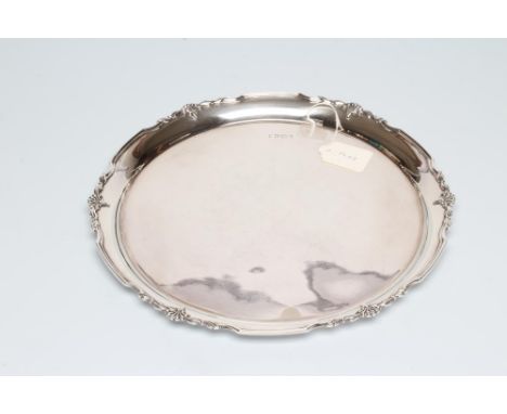 A SILVER SALVER, maker Cooper Bros. &amp; Sons, Sheffield 1968, of plain circular form, the reeded rim with anthemion and scr