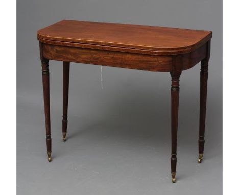 A GEORGIAN MAHOGANY FOLDING TEA TABLE, c.1800, of rounded oblong form with rosewood banding and stringing, string inlaid frie