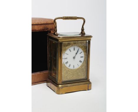 A BRASS CASED CARRIAGE CLOCK, c.1900, the twin barrel movement with platform escapement striking on a gong, the white enamel 