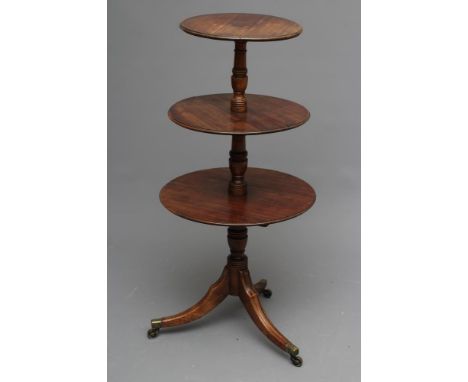 A GEORGIAN MAHOGANY DUMB WAITER, c.1800, the three graduated moulded edged trays each with twin flaps, on ring and vase turne