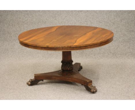 A VICTORIAN ROSEWOOD CENTRE TABLE, the circular tilt top with well figured veneers and plain frieze, raised on turned taperin