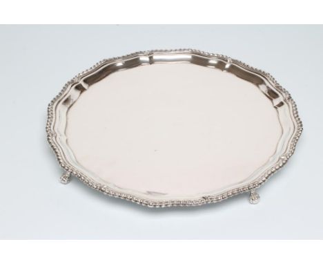 A SILVER SALVER, maker Barker Ellis Silver Co., Birmingham 1967, of shaped circular form with gadrooned pie-crust rim, raised