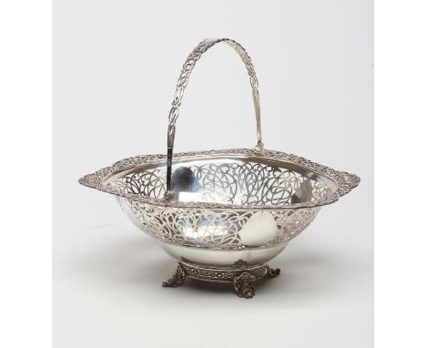 A SILVER BASKET, maker Wakely &amp; Wheeler, London 1914, of deep oval form, the everted cast and pierced Celtic knot and myt