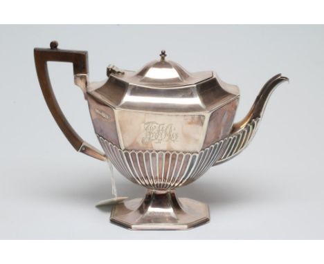 A LATE VICTORIAN SILVER PEDESTAL TEAPOT, maker's mark indistinct, Sheffield 1895, of semi fluted canted oblong form with swep