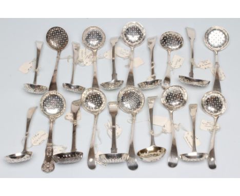 A COLLECTION OF GEORGE III AND LATER SILVER SUGAR SIFTER SPOONS, all with plain cross and spot pierced bowls including a doub