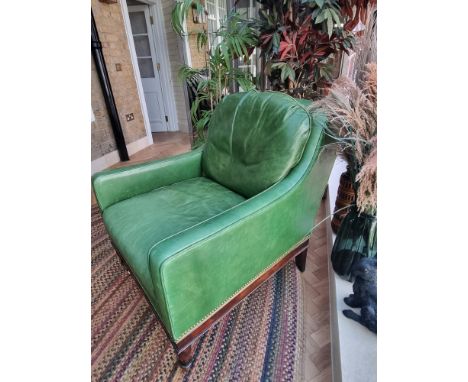 A&nbsp; Green Leather upholstered vintage armchair on castor front legs reupholstered in a racing green leather 90 x 74 x 86c