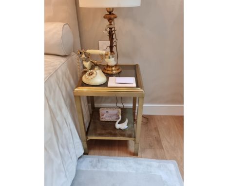 A Pair of French mid-century gilt-brass side tables with two tiers and gold eglomise glass tops, attributed to Maison Jansen&