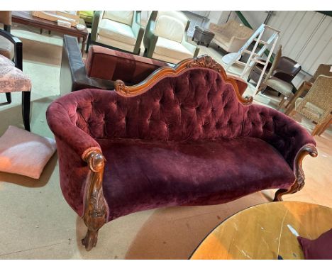 Beautiful carved wooden sofa upholstered in puple velvet