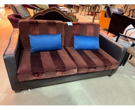 Tuxedo sofa upholstered in burgundy striped velvet this deep 2 seater sofa is wrapped in brown leather on wooden legs 170 x 9