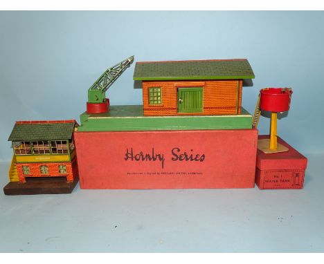 Hornby O gauge, a boxed No.2 Goods E, platform, a No.2 signal cabin, (no box, with electric light) and a boxed No.1 water tan