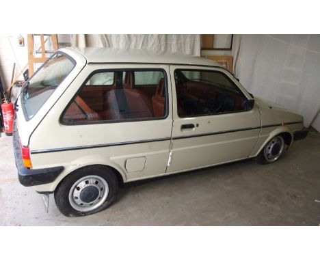 An Austin Mini Metro 1.3L HLS 3-door hatchback motor car, registration number POD 435W, sand colour, "Paprika" interior uphol