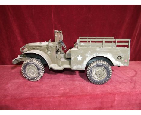 A 21st Century Toys 1/6 scale model of a U.S. Army open troop carrier. 