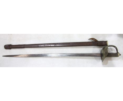 A George V military pattern sword, with basket hilt, fish skin grip and single fullered 82cm blade, in leather-covered scabba