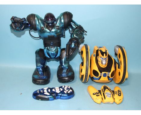 A Bossa Nova Prime 8 Gorilla Action Robot with remote control, a Mark Tilden robot with remote, a large quantity of superhero