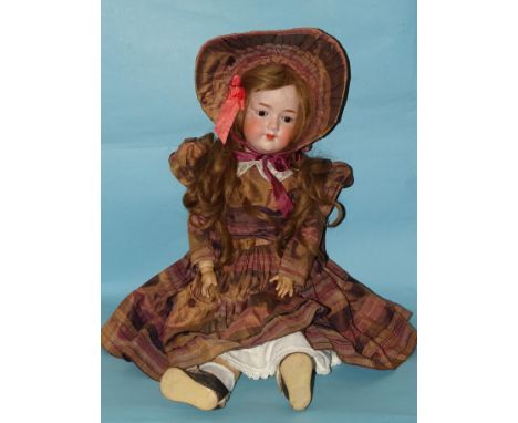 An Armand Marseille 390 bisque head doll with sleeping brown eyes, open mouth and brown wig on jointed composition and wood b