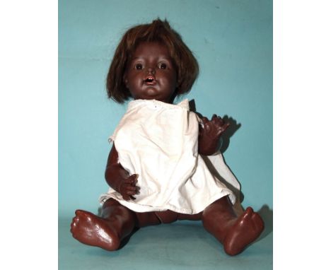 A Diamond Pottery Co. black bisque head doll with fixed brown eyes and open mouth, on composition&nbsp; and wood toddler body