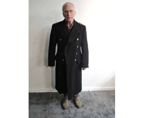 A Naval Great Coat, Captains Rank shoulder epaulettes, 11 large brass buttons and two small brass buttons, medium size but no