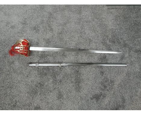 A Reproduction Scottish Basket Hilt Broadsword with metal scabbard, blade length 84cm, overall length 99cm