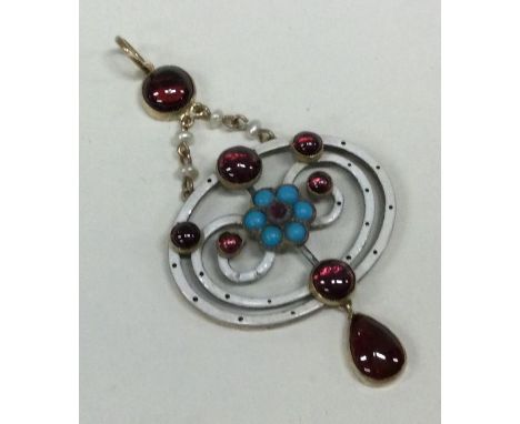 An attractive enamel and cabochon garnet pendant in gold. Approx. 7 grams. Est. £150 - £200.