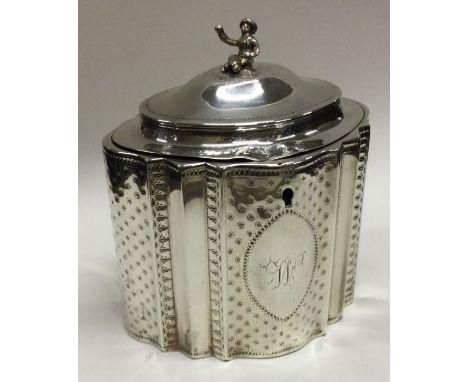 A Georgian silver hinged tea caddy with Chinoiserie finial. London 1789. By Robert Hennell. Approx. 392 grams. Est. £800 - £1