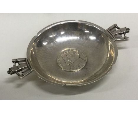 A silver wine taster/bleeding bowl. London 1935.  By R E Stone and Asprey &amp; Co. Approx. 91 grams. Est. £180 - £220.