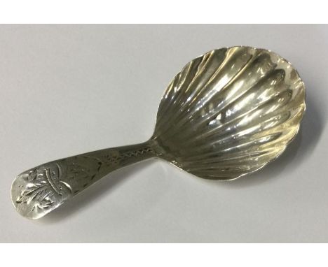 A George III 18th Century fluted silver caddy spoon. London 1794. Approx. 8 grams. Est. £30 - £50.