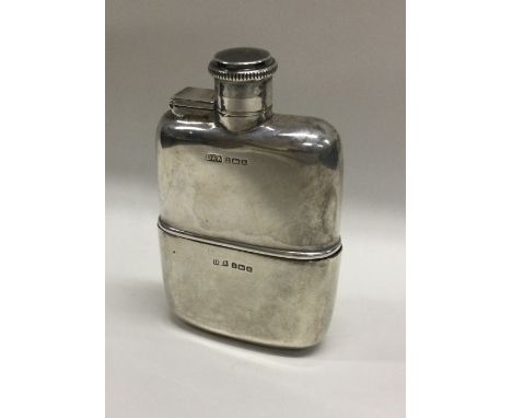 A novelty silver hip flask with removable cup. Birmingham 1934. By Daniel and Arter. Approx. 125 grams. Est. £250 - £300.