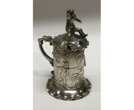 An Antique silver chased toy caddy embossed with cherubs. Approx. 24 grams. Est. £50 - £80.