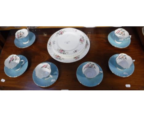 A SET OF SIX AYNSLEY PALE BLUE AND FLORAL DECORATED TEA CUPS AND SAUCERS with six 'Howard Sprays' side plates and a cake plat