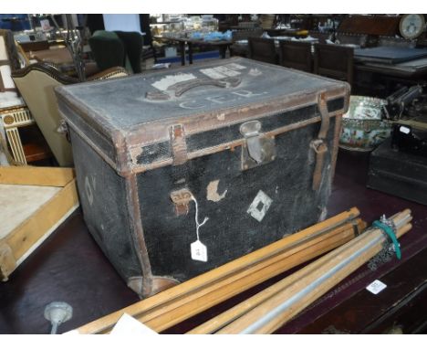 A VINTAGE LEATHER AND CANVAS HAT BOX with railway labels and two photographic tripods