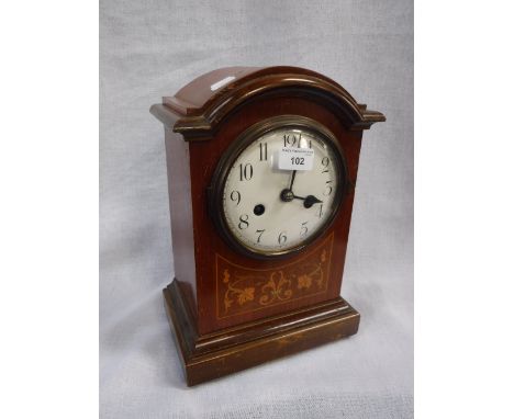 AN EDWARDIAN MAHOGANY MANTEL CLOCK with white enamel dial (key and pendulum in office)