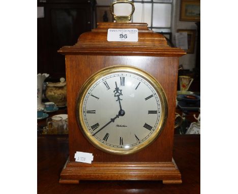 A WALNUT CASED 'ROTHERHAM' MANTEL CLOCK