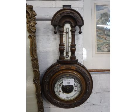 A VICTORIAN WALNUT CASED BAROMETER